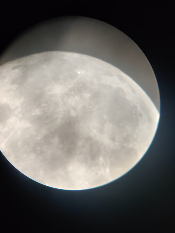 Moon through the telescope. Image Credit: Nathan