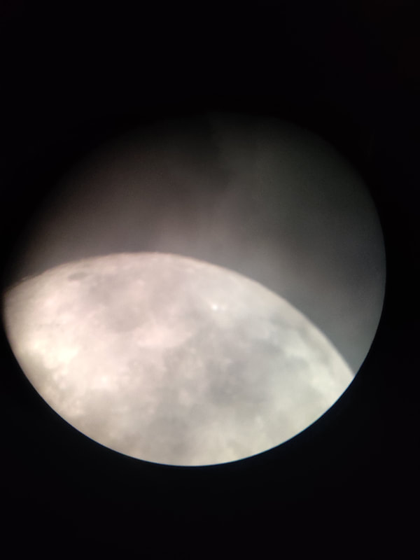 Moon through the telescope. Image Credit: Nathan